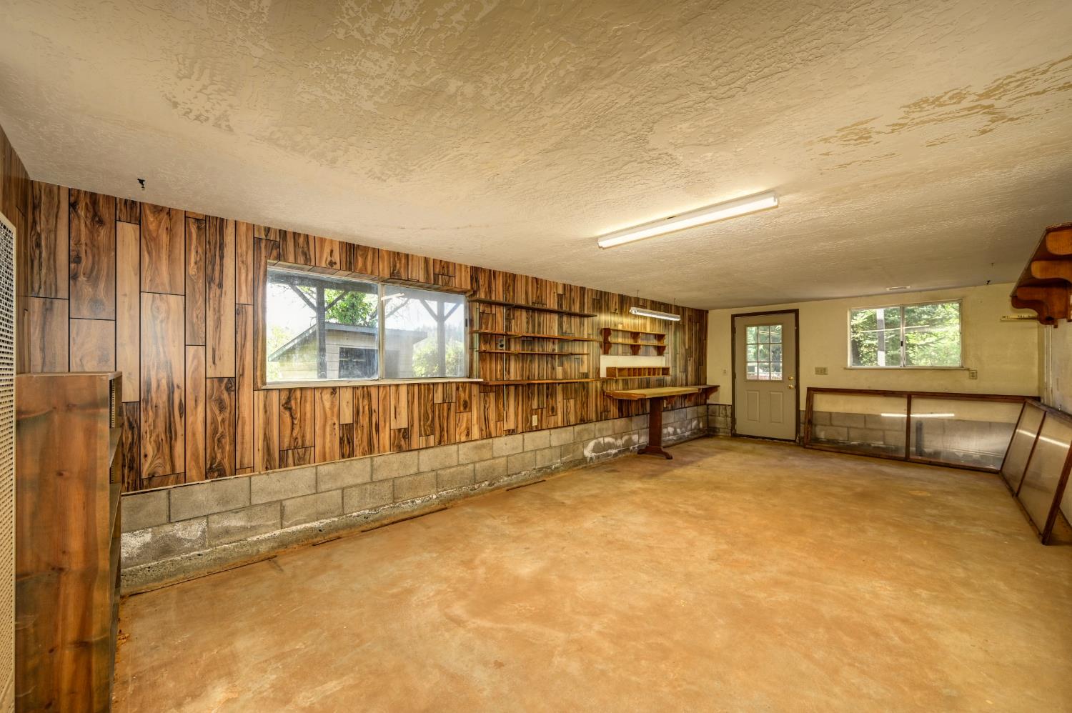 4541 Meadowbrook Road Garden Valley, CA 95633 - Photo 58 of 71 basement with a textured ceiling and wood walls