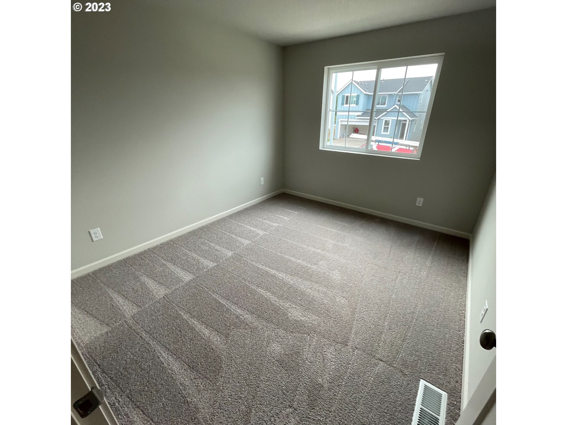 2083 Southeast Pheasant Avenue Gresham, OR 97080 - Photo 16 of 30 a view of an empty room with windows