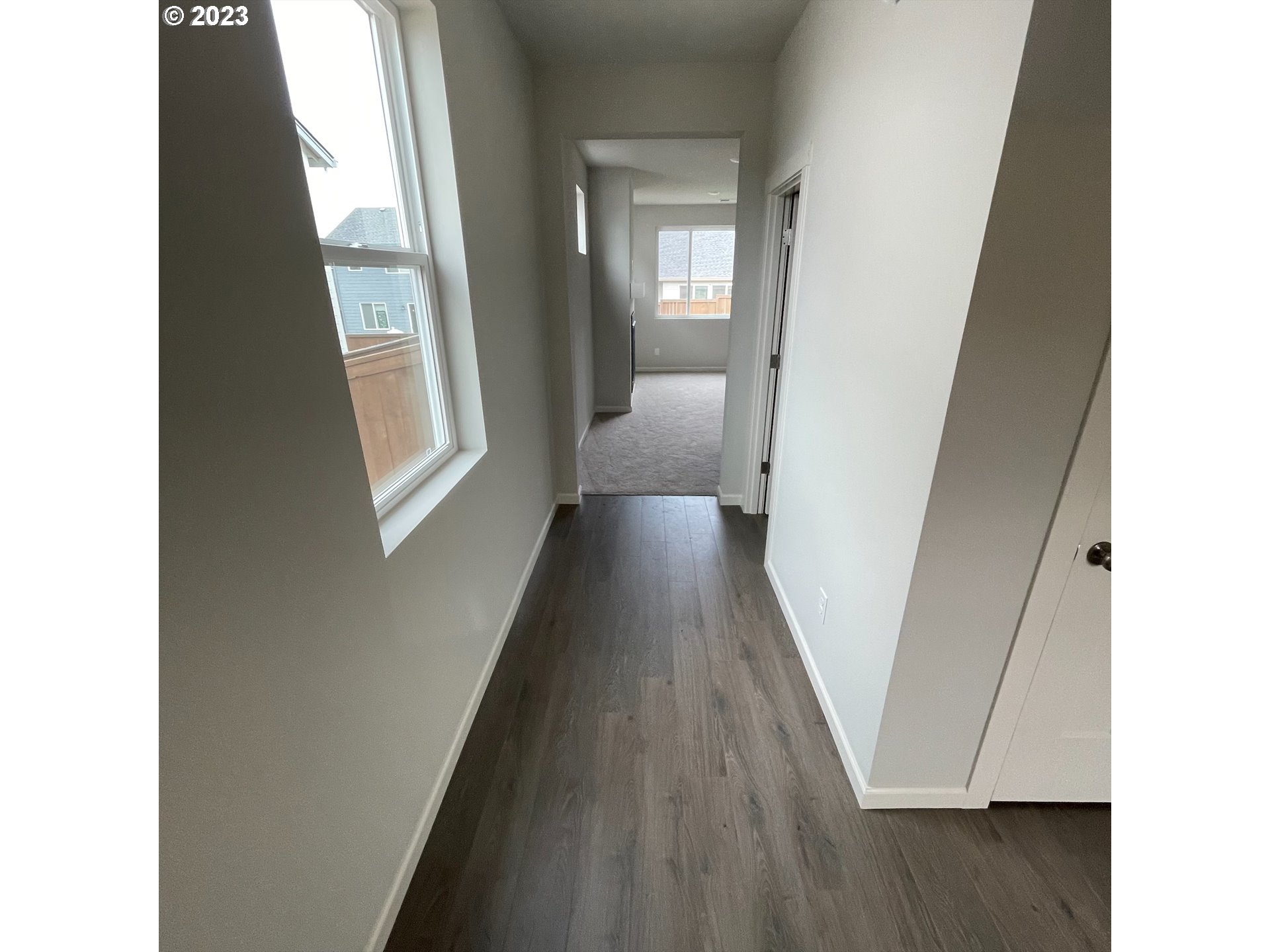 2083 Southeast Pheasant Avenue Gresham, OR 97080 - Photo 25 of 30 a view of a hallway with wooden floor and staircase