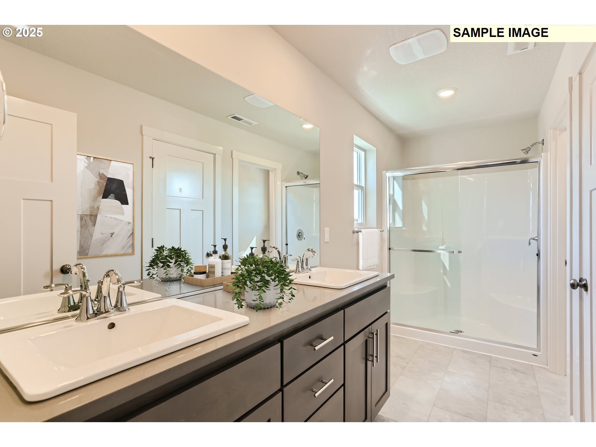 2083 Southeast Pheasant Avenue Gresham, OR 97080 - Photo 10 of 30 a bathroom with a sink mirror and a shower