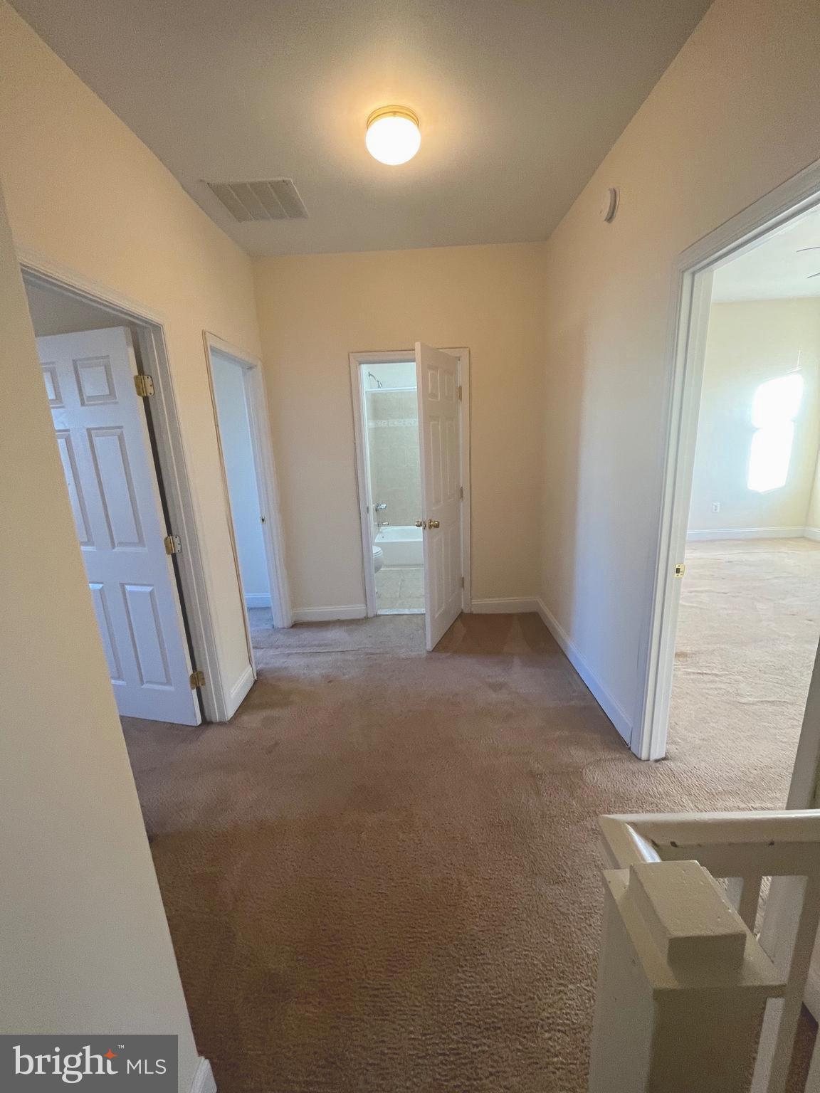 1634 Chilton Street Baltimore, MD 21218 - Photo 8 of 18 an empty room with windows