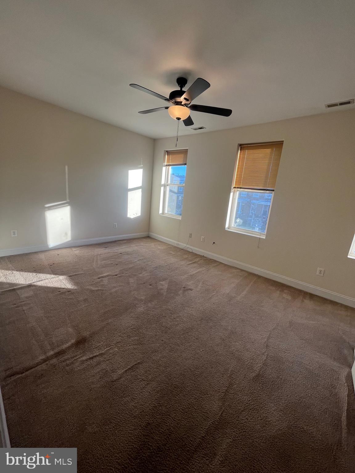 1634 Chilton Street Baltimore, MD 21218 - Photo 10 of 18 a view of a livingroom with a ceiling fan and window