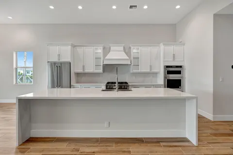 a white bath tub sitting next to a bathroom