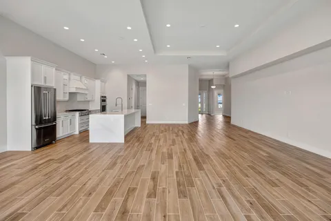 an aerial view of a residential apartment building with a yard and plants