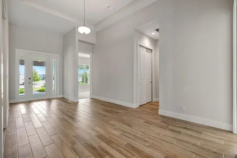 an aerial view of a house with a swimming pool