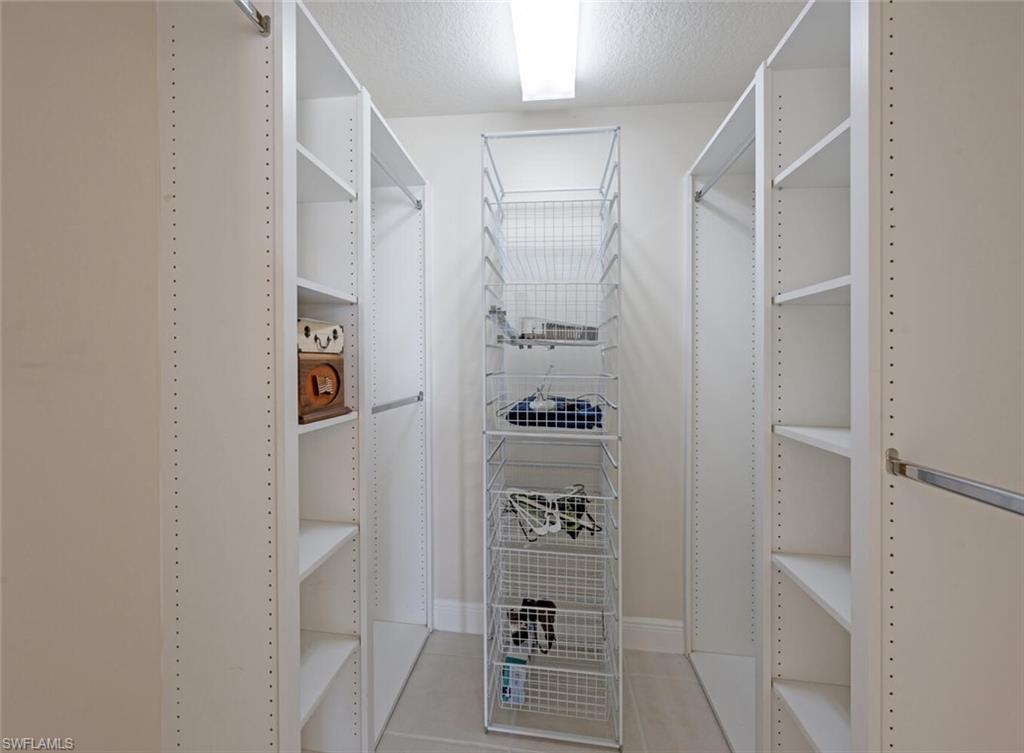 4231 Redonda Lane Naples, FL 34119 - Photo 13 of 28 a bathroom with a shower and a sink