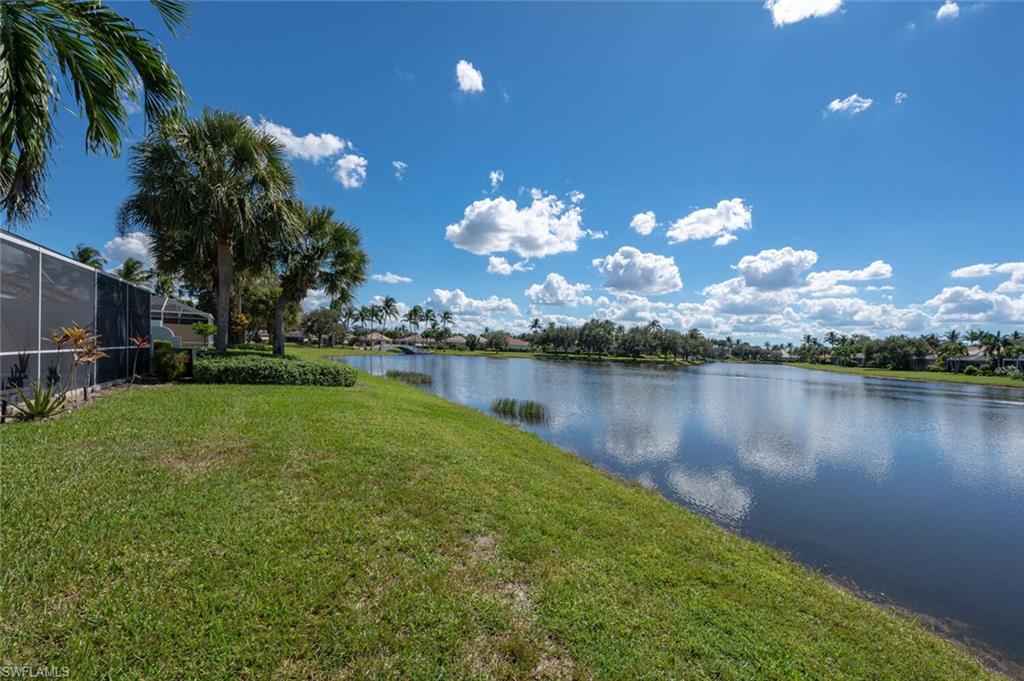 4231 Redonda Lane Naples, FL 34119 - Photo 20 of 28 a view of a lake in middle of a house with a lake view
