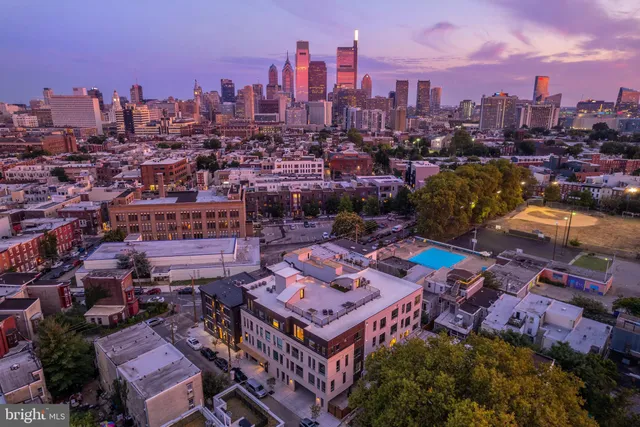 an aerial view of a city with lots of residential buildings