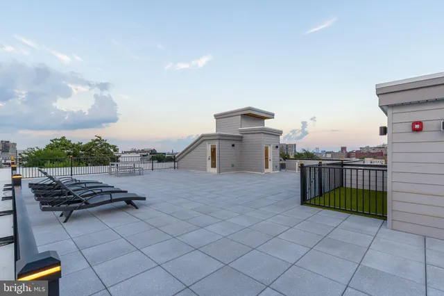 a balcony with chairs and table