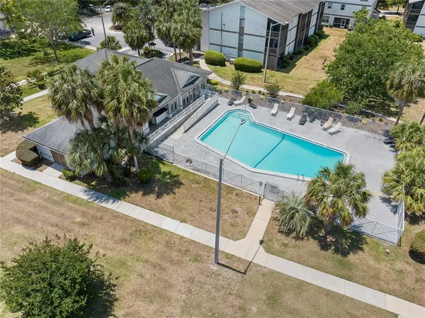 an aerial view of a house with a garden