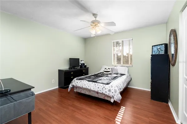 a bedroom with bed and window