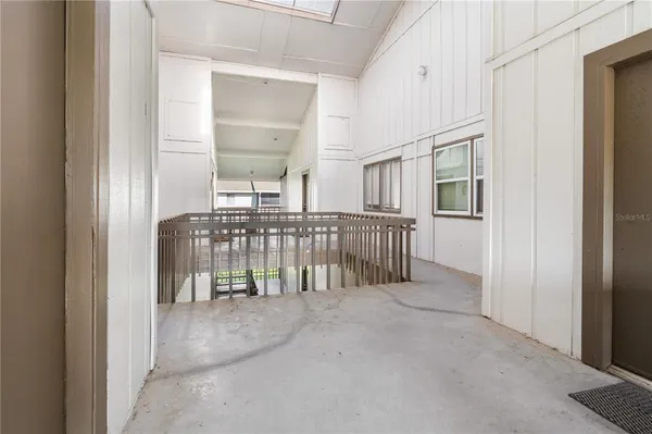 a view of a hallway with a bedroom