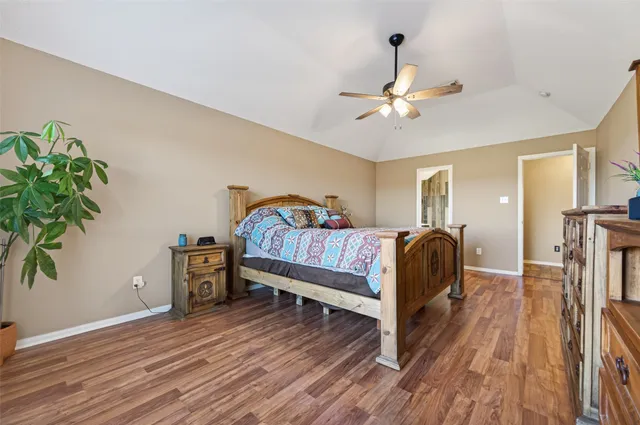 a bedroom with furniture and a chandelier
