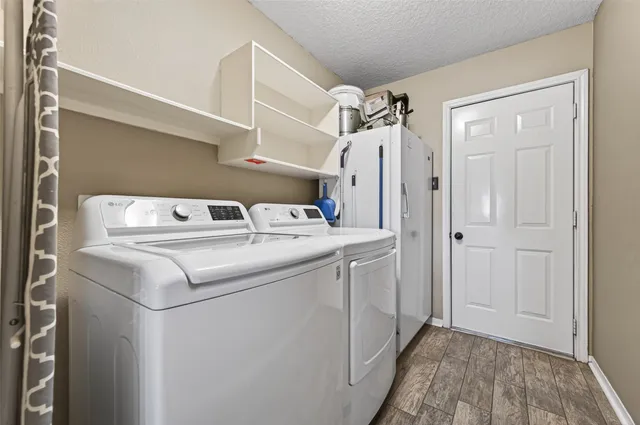 a utility room with dryer and washer
