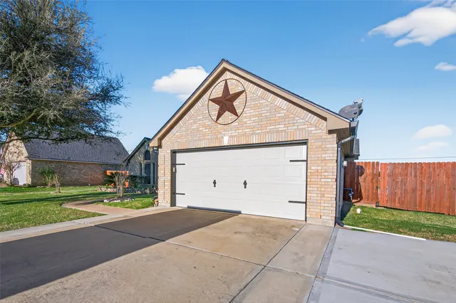 a view of backyard of house and car parked