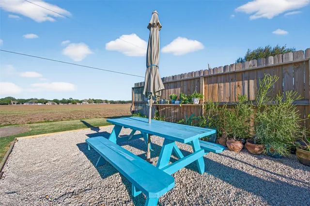 a view of a balcony with lake view and wooden floor