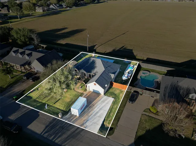 a view of a backyard with chairs