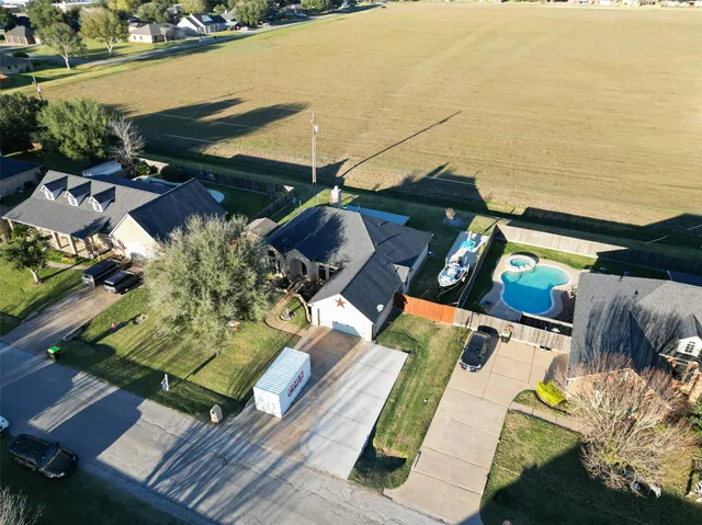 an aerial view of a house with a ocean view
