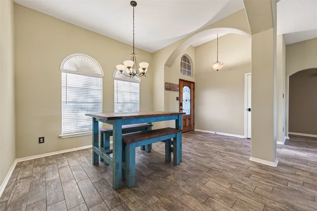 a view of a livingroom with furniture window and wooden floor