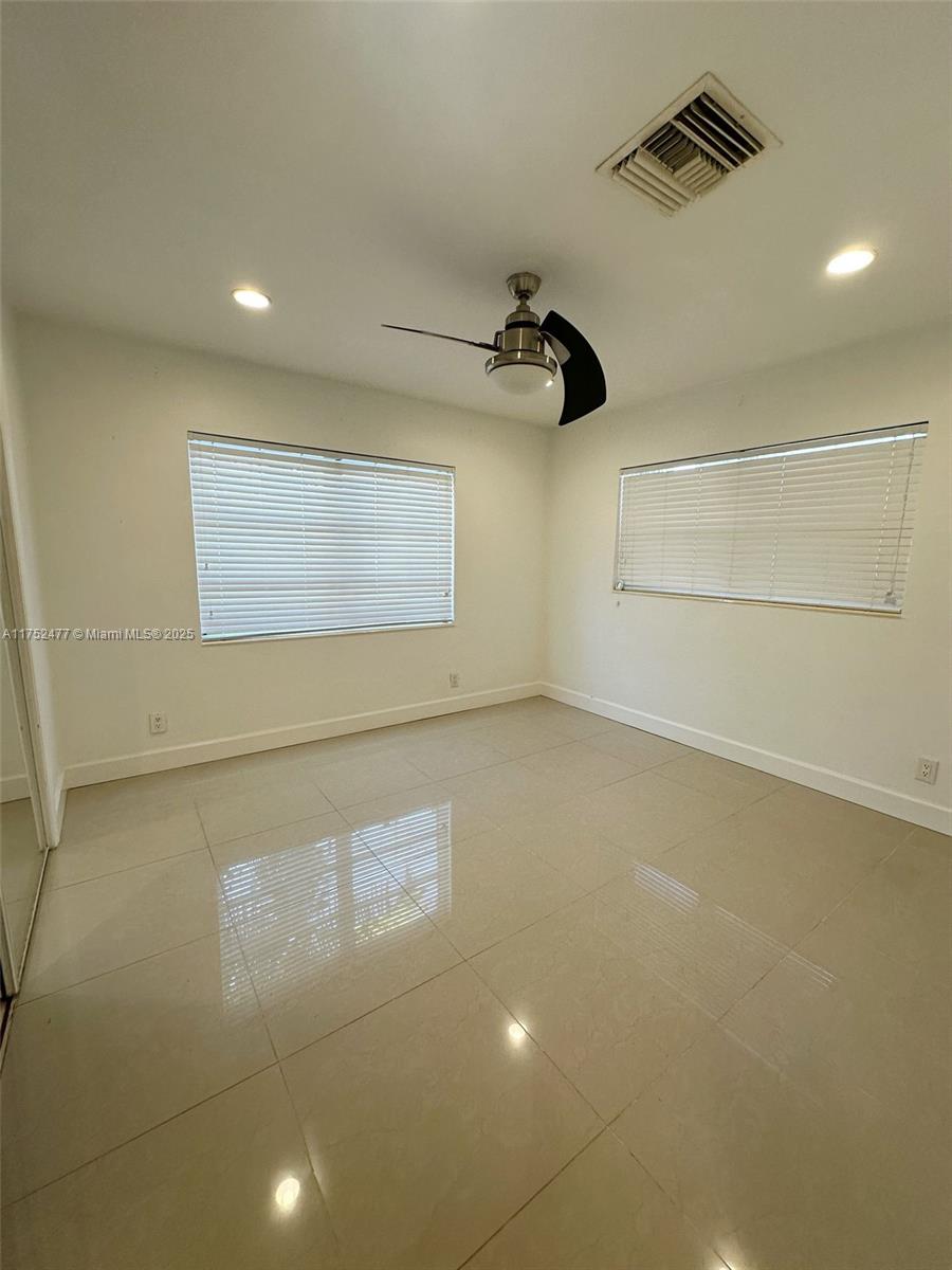 317 Hendricks Isle, Unit 1 Fort Lauderdale, FL 33301 - Photo 8 of 15 an empty room with a empty space and windows