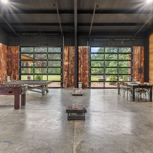 8321 Ebenezer Road Buena Vista, GA 31803 - Photo 35 of 61 3 glass paneled garage doors line the rec area