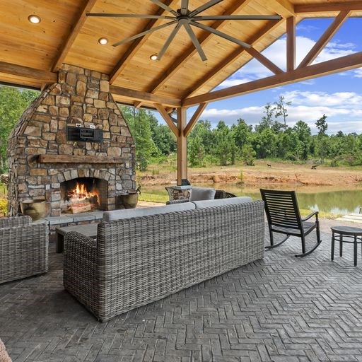 8321 Ebenezer Road Buena Vista, GA 31803 - Photo 43 of 61 outdoor stacked stone fireplace with sitting area