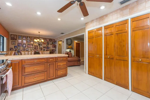 a bedroom with a bed and a ceiling fan