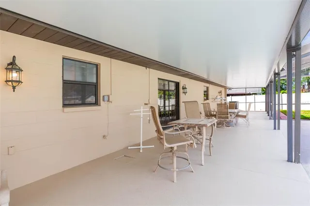 a view of a backyard with swimming pool