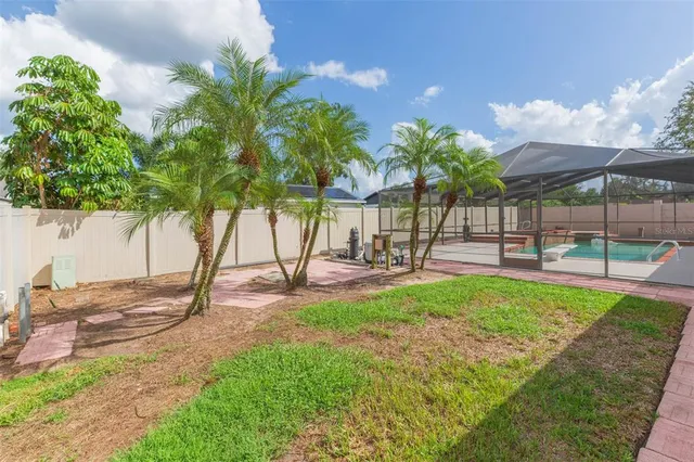 a backyard of a house with lots of green space