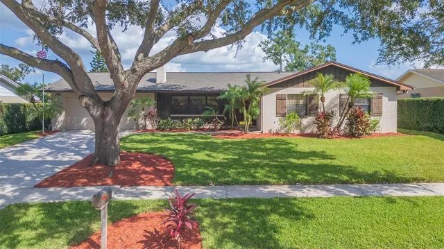 an aerial view of residential houses with city view