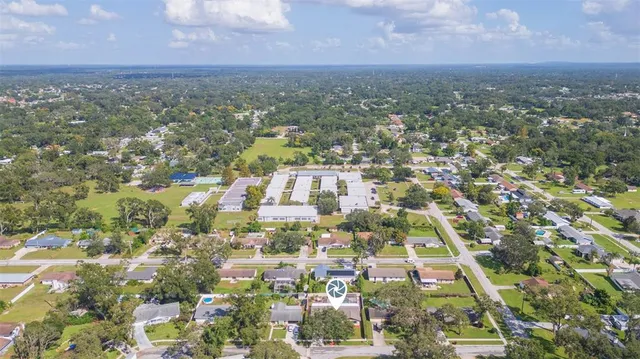 an aerial view of residential building and green space