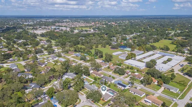 an aerial view of residential building and green space