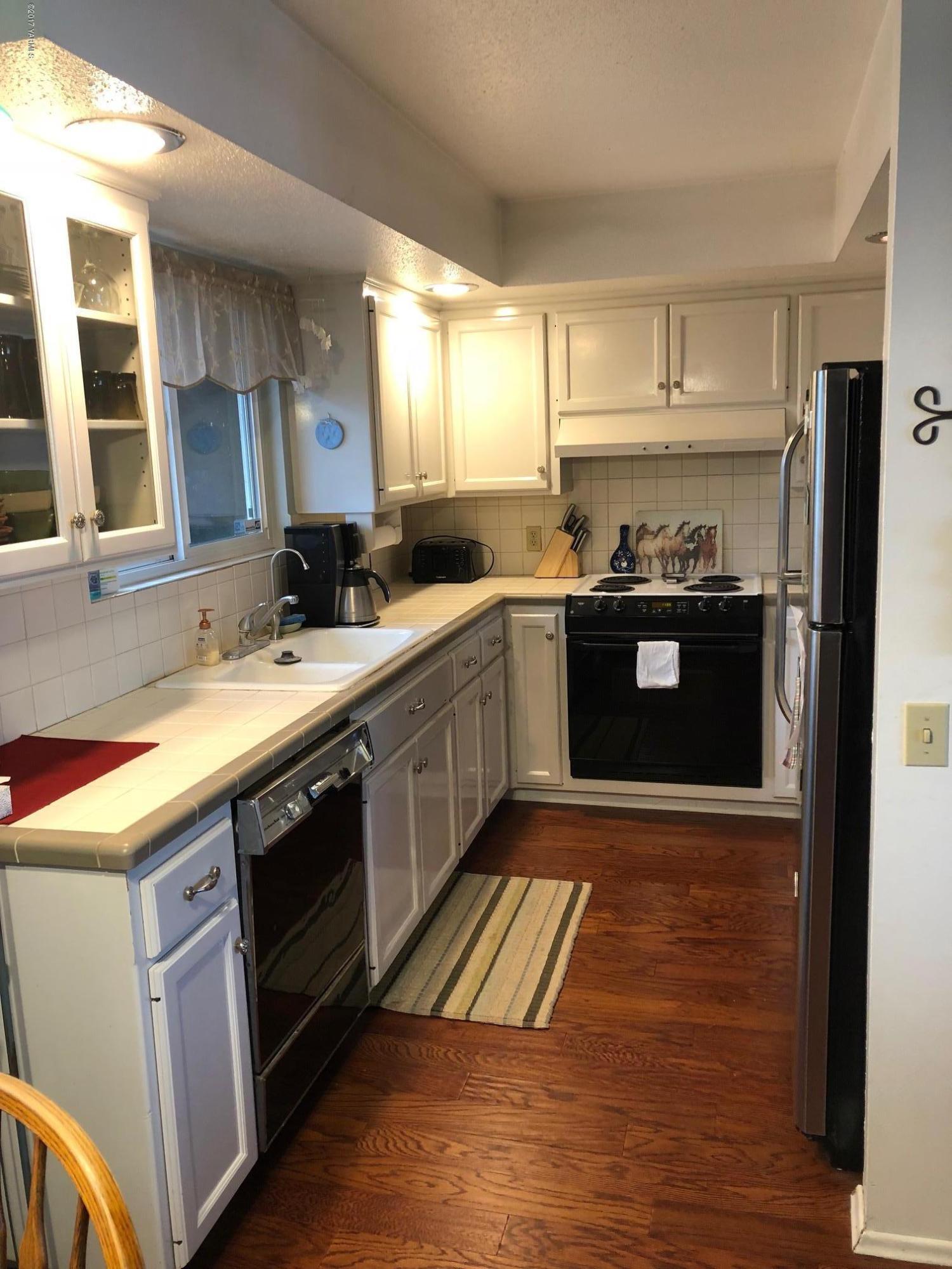 139601 Mccredie Road West Prosser, WA 99350 - Photo 27 of 55 a kitchen with a sink stove and cabinets