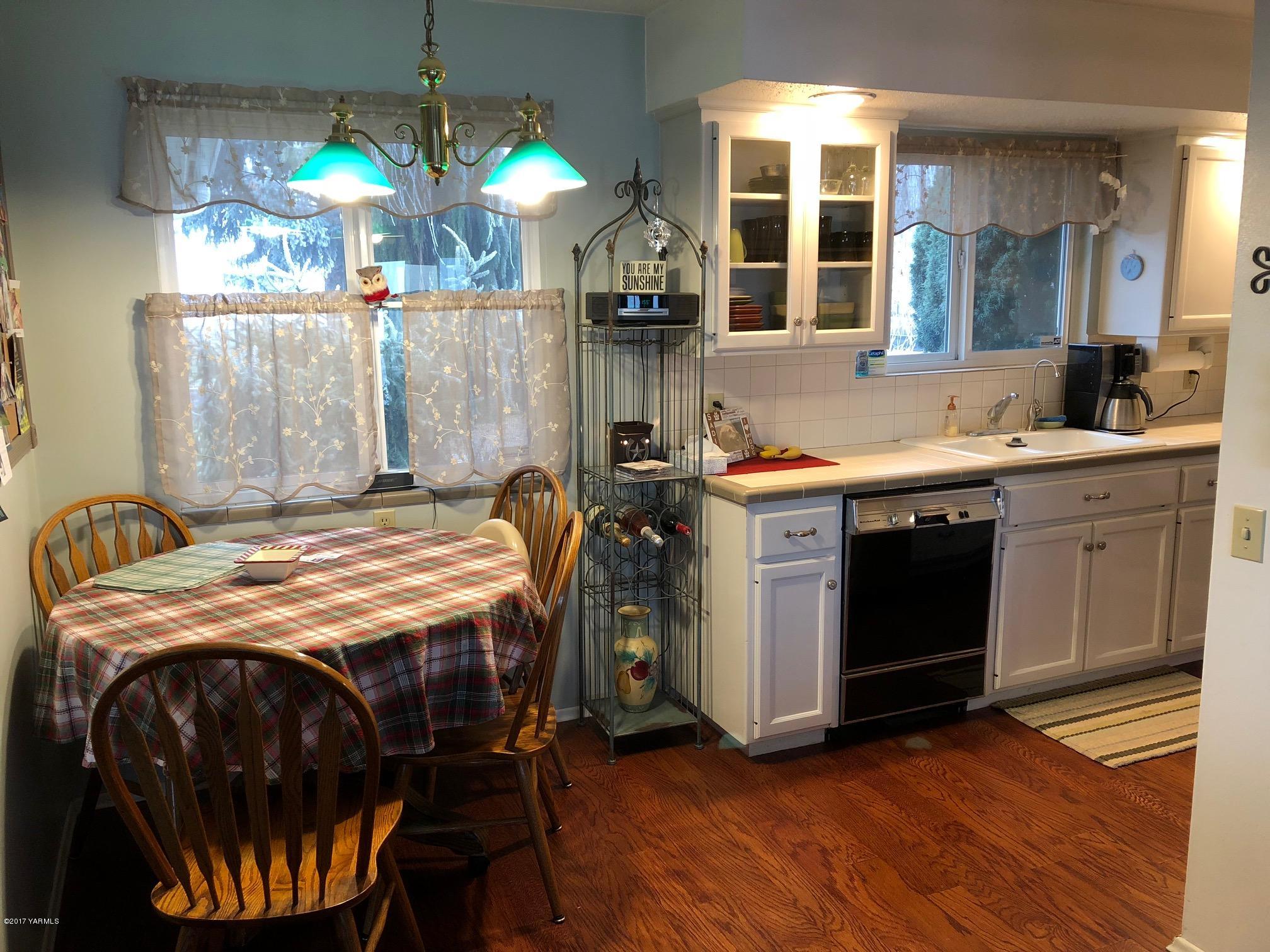 139601 Mccredie Road West Prosser, WA 99350 - Photo 29 of 55 a kitchen with a stove a sink and a chandelier