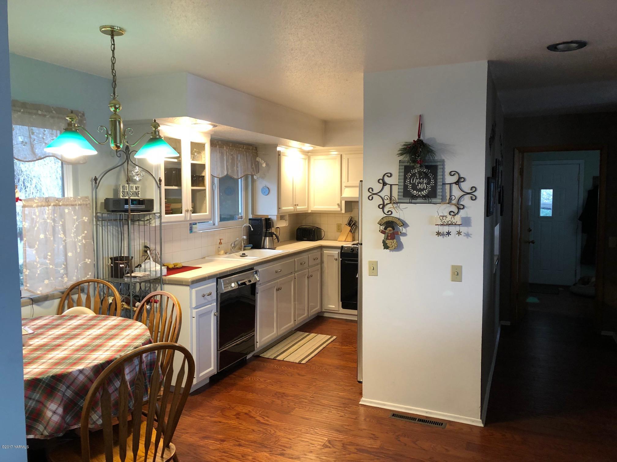 139601 Mccredie Road West Prosser, WA 99350 - Photo 30 of 55 a kitchen that has a lot of cabinets a sink and a refrigerator