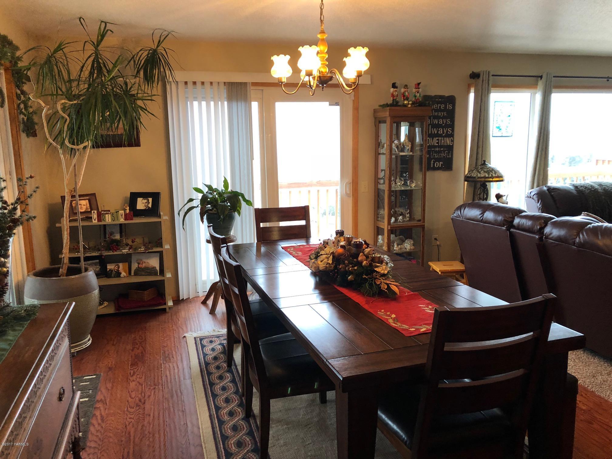 139601 Mccredie Road West Prosser, WA 99350 - Photo 34 of 55 a view of a dining room with furniture window and wooden floor