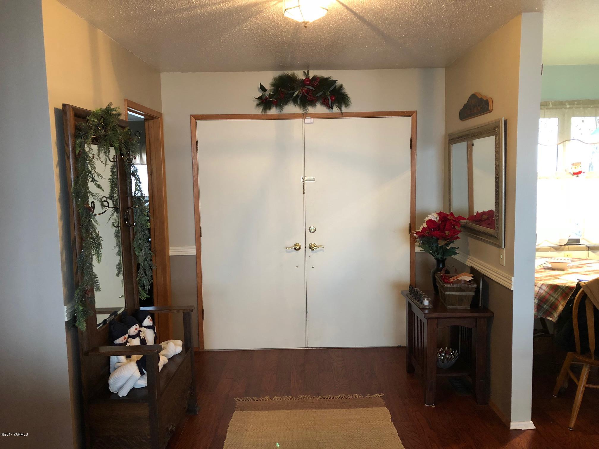 139601 Mccredie Road West Prosser, WA 99350 - Photo 38 of 55 a view of a hallway with wooden floor and a living room