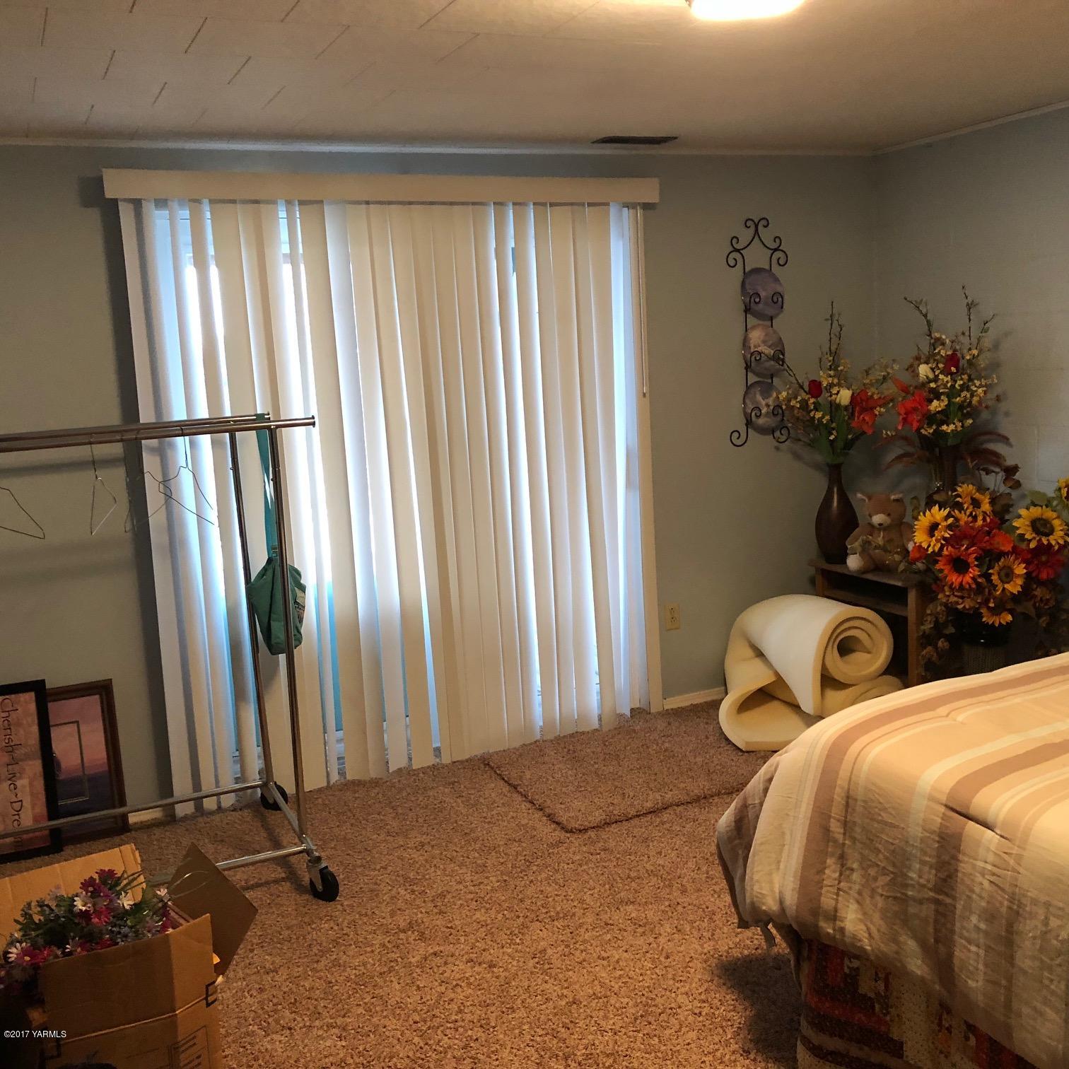 139601 Mccredie Road West Prosser, WA 99350 - Photo 52 of 55 a bedroom with bed and window