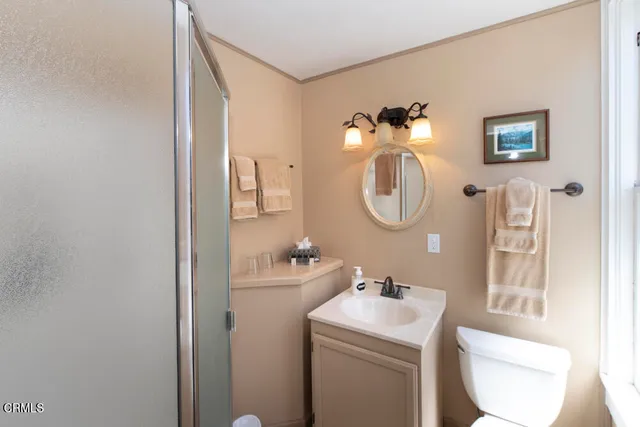 a bathroom with a sink toilet and vanity