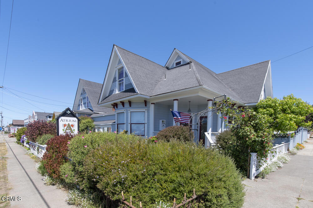700 North Main Street Fort Bragg, CA 95437 - Photo 2 of 64 a view of a house with a small yard and plants