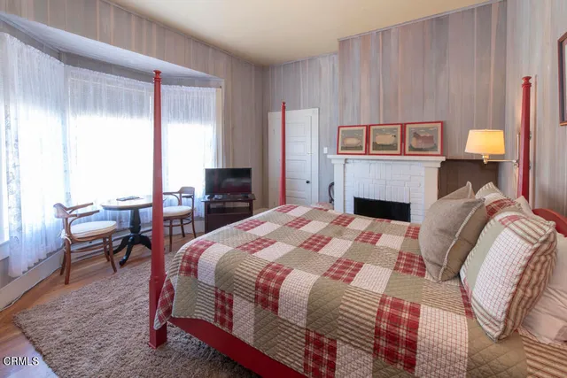 a bathroom with a toilet and a shower curtain