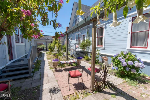 an aerial view of a house with outdoor space
