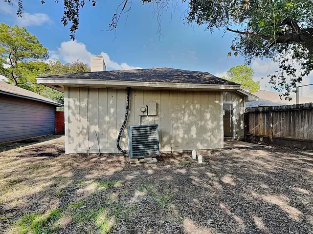 a view of a house with a tree