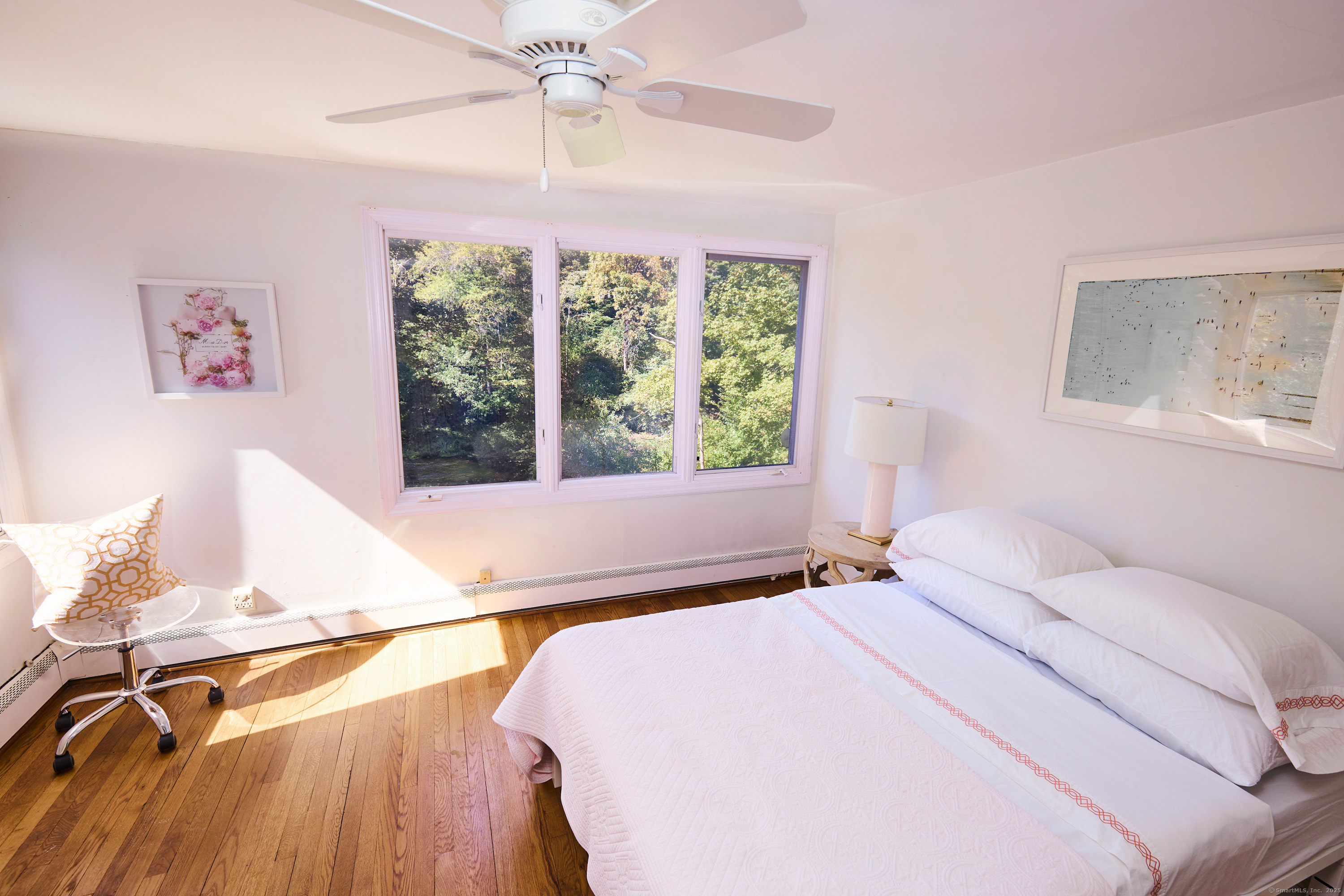 136 Lyons Plain Road Weston, CT 06883 - Photo 23 of 31 a bedroom with a bed and a window