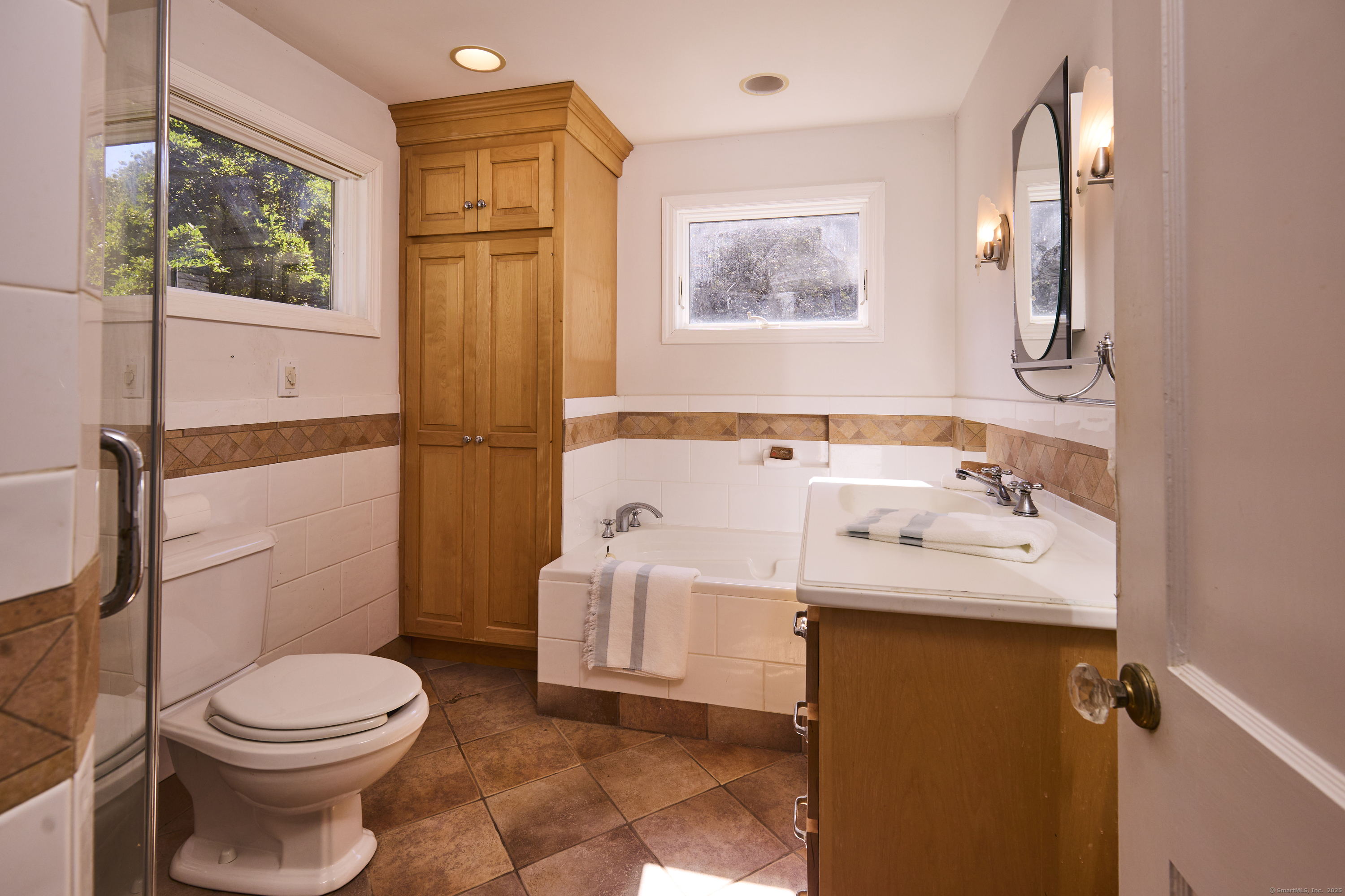 136 Lyons Plain Road Weston, CT 06883 - Photo 24 of 31 a bathroom with a sink toilet and shower