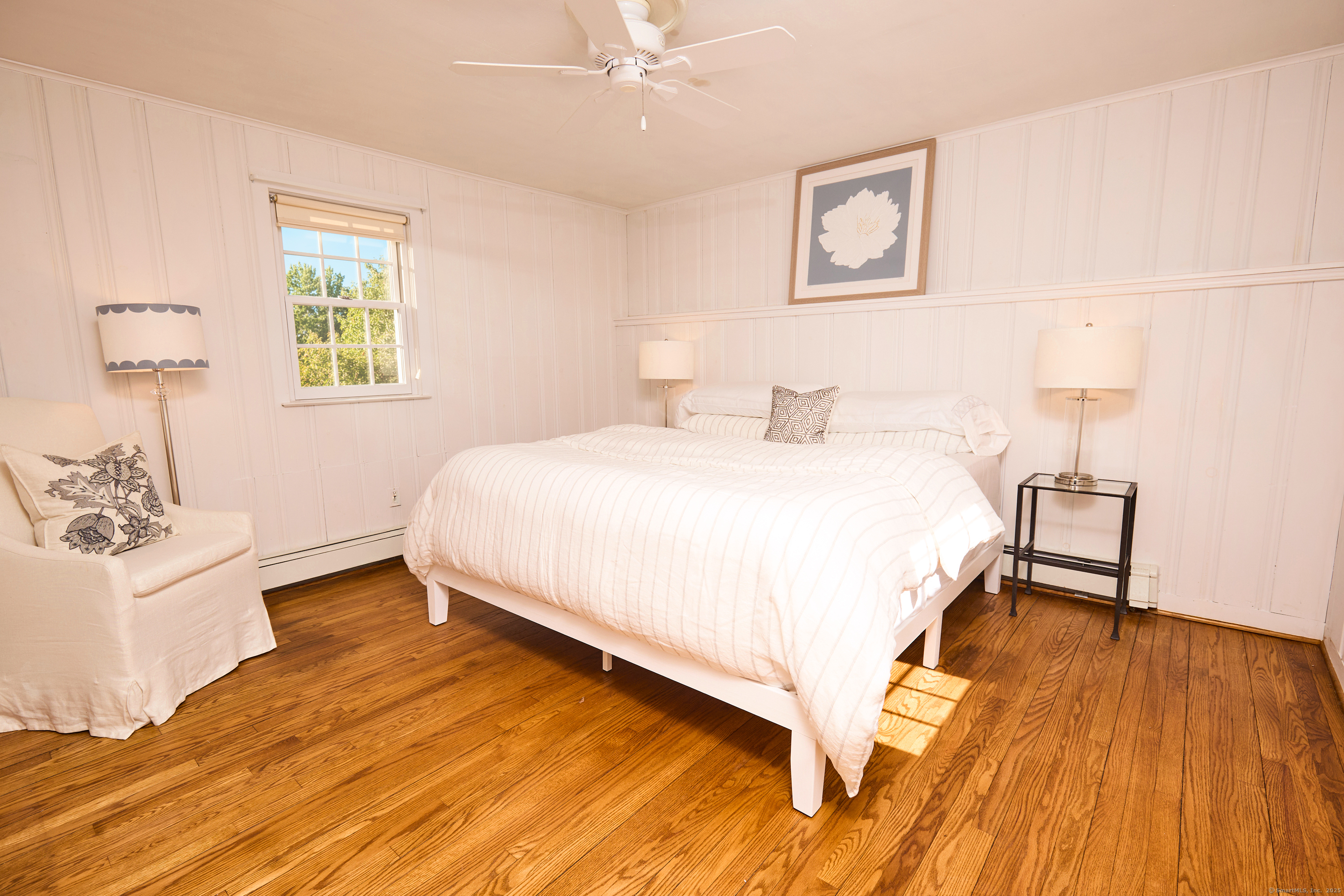 136 Lyons Plain Road Weston, CT 06883 - Photo 26 of 31 a bedroom with a bed and a table