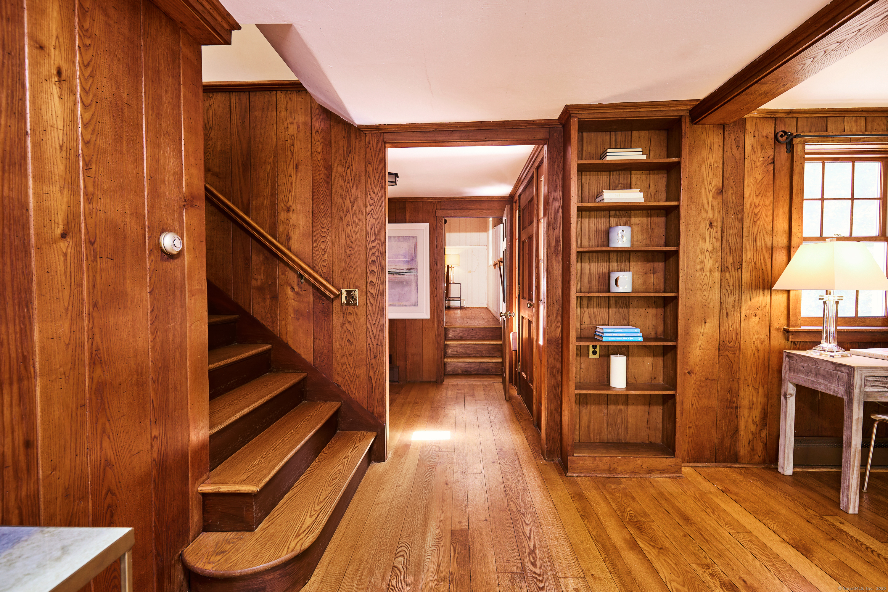 136 Lyons Plain Road Weston, CT 06883 - Photo 27 of 31 a view of entryway and hall with wooden floor