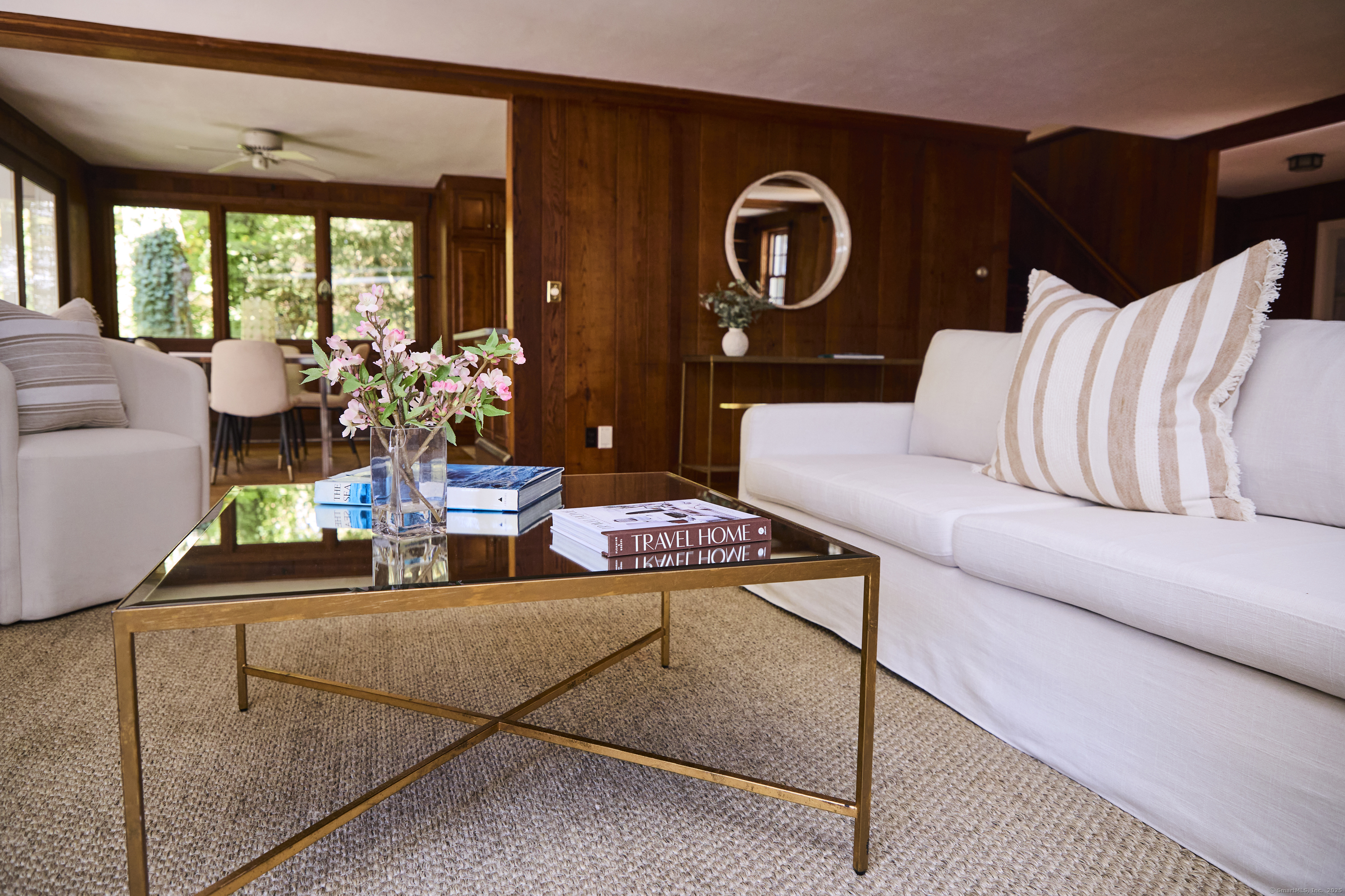136 Lyons Plain Road Weston, CT 06883 - Photo 6 of 31 a living room with furniture and a large window