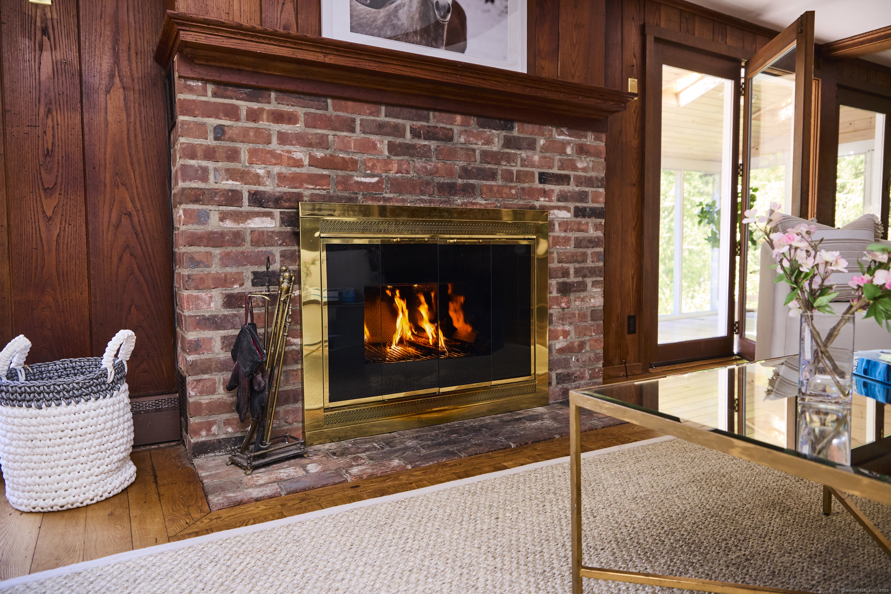 136 Lyons Plain Road Weston, CT 06883 - Photo 7 of 31 a living room with furniture and a fireplace
