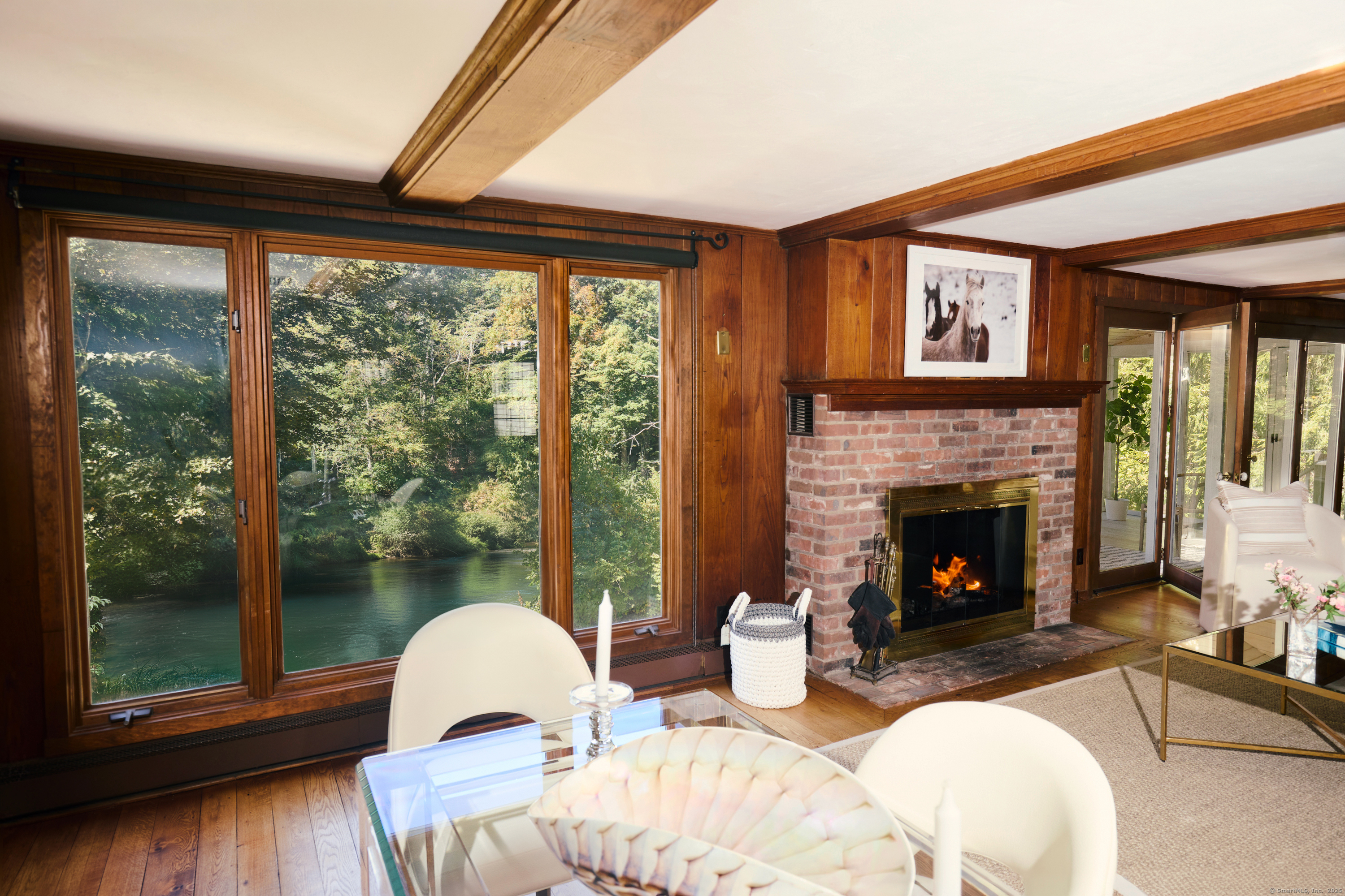 136 Lyons Plain Road Weston, CT 06883 - Photo 8 of 31 a living room with furniture and a fireplace
